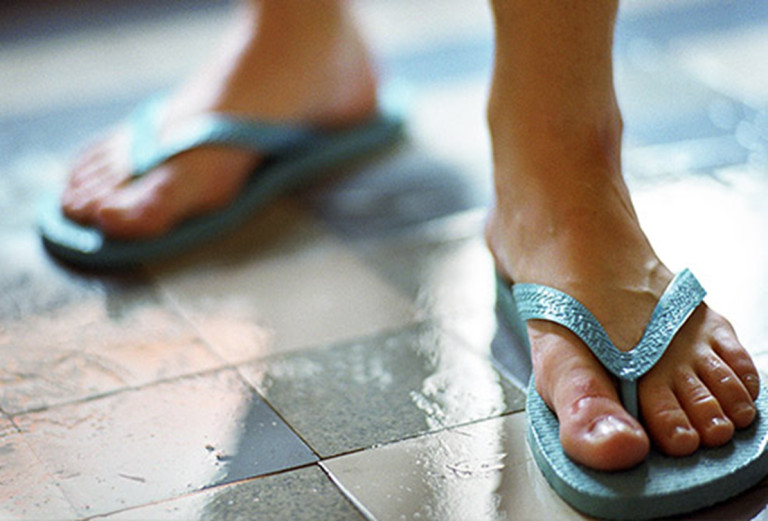 Slippers in Public Bath - The Sole Clinic