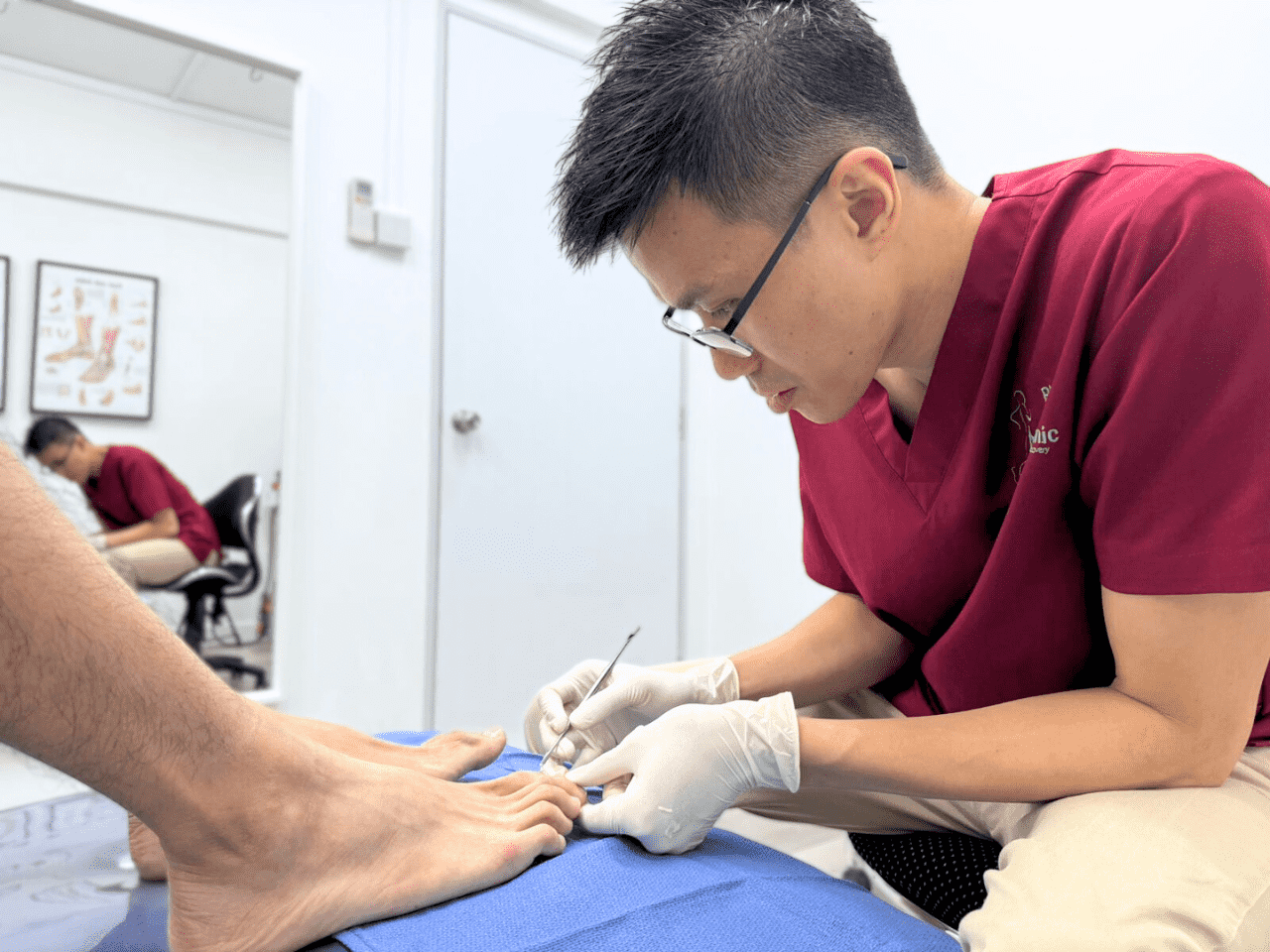Podiatrist assessing a patient
