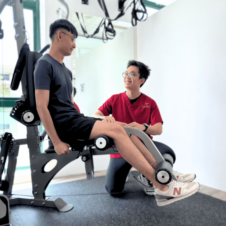 Physiotherapist guiding a patient through leg-strengthening exercise equipment