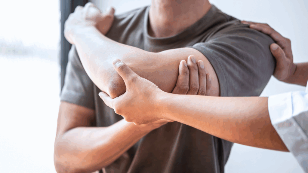 Sports Physiotherapist examining and treating an athlete