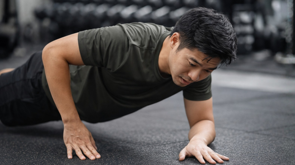Active adult struggling to complete a push-up due to reduced arm strength after elbow injury
