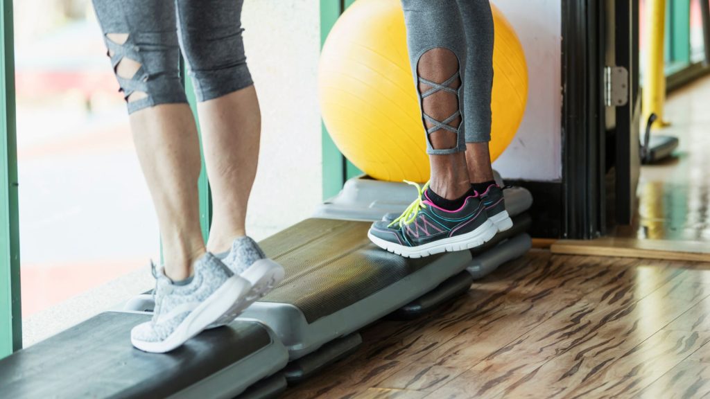 Athlete running on treadmill showing exercises that strengthen feet and lower legs to prevent running foot pain