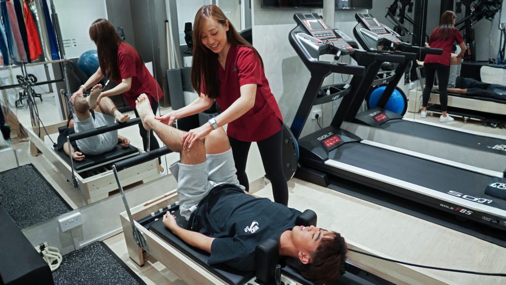 Physiotherapy rehabilitation session in Singapore showing hands-on treatment for injury recovery and mobility improvement