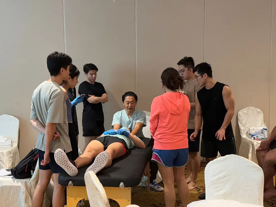Clinicians gathered round a hands-on demonstration at an AHA course