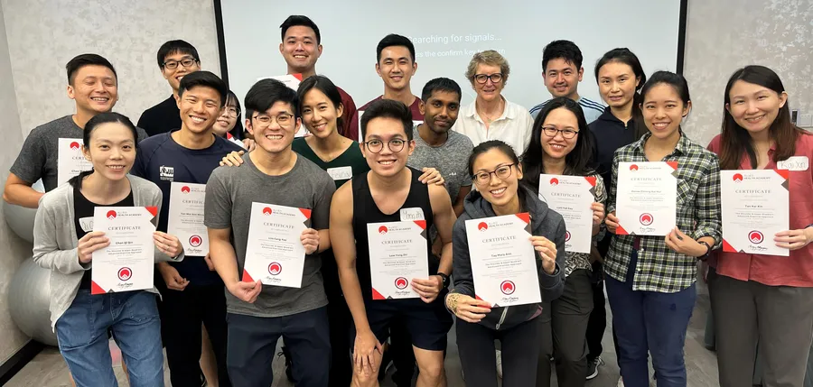 Clinicians with their certificates after completing a course