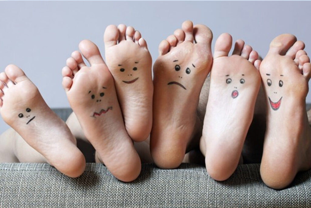 funny faces drawn on feet