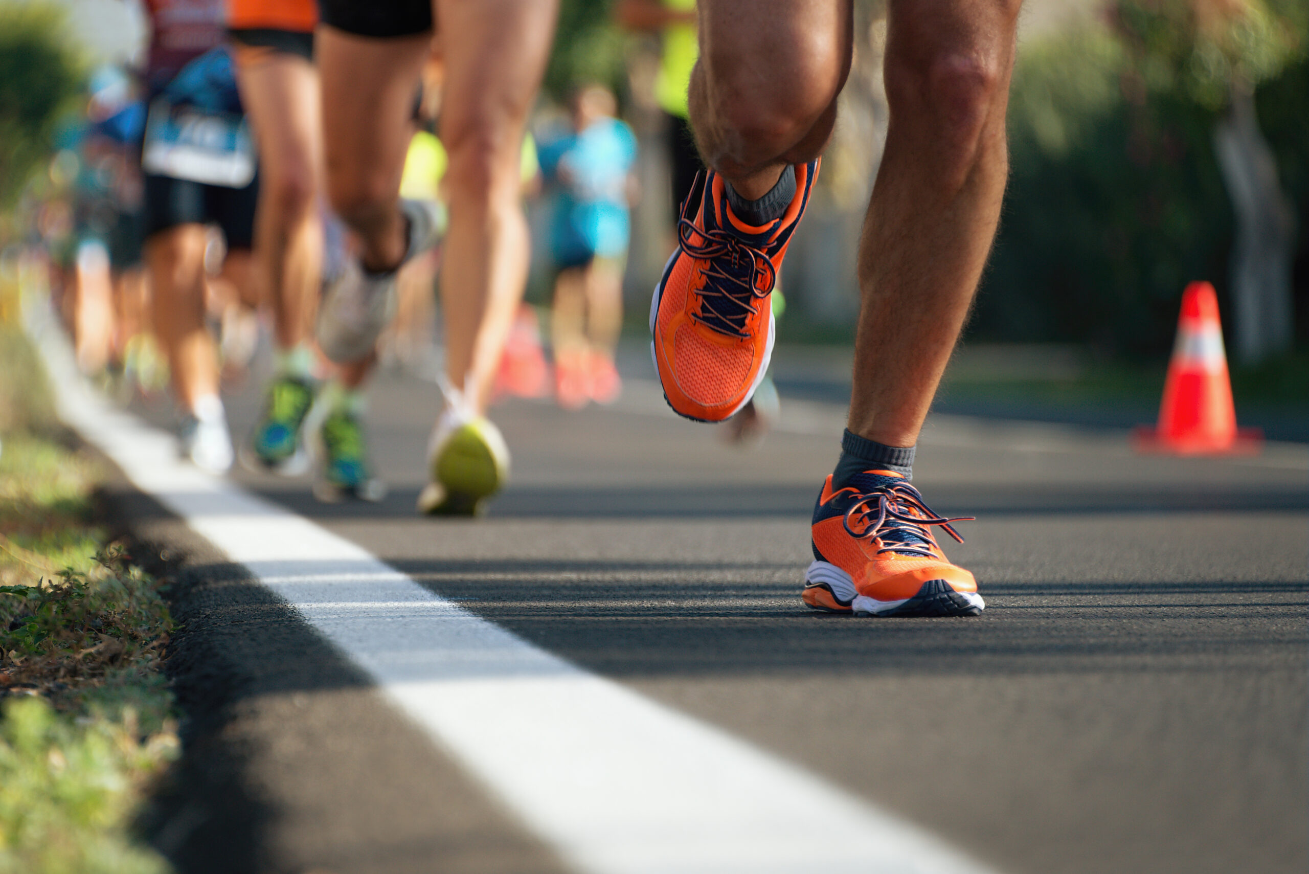 a bunch of people running in a race