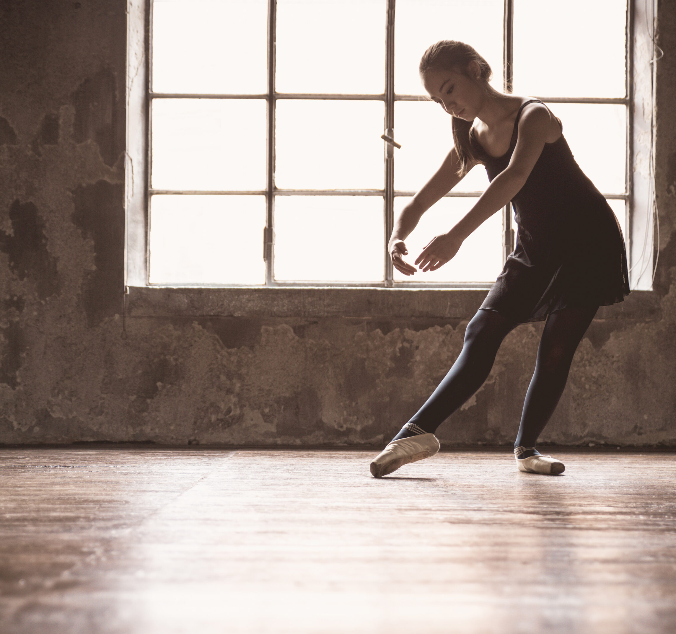 a women dancing in ballet shoes