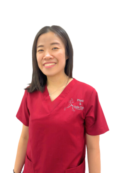 Physio and Sole Clinic Podiatrist Joanne in red scrubs