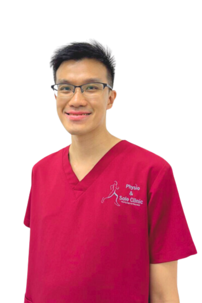 Physio and Sole Clinic Principal Podiatrist Kelvin in red scrubs