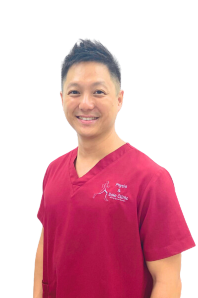 Physio and Sole Clinic Principal Podiatrist Siew Keong (SK) in red scrubs