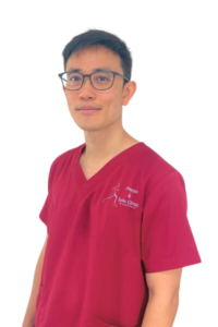 Physio and Sole Clinic Principal Podiatrist toto in red scrubs