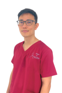 Physio and Sole Clinic Principal Podiatrist toto in red scrubs