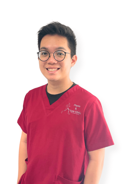 Physio and Sole Clinic Principal Musculoskeletal Physiotherapist Yang Zhi in red scrubs
