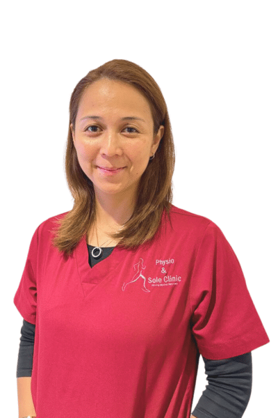 Physio and Sole Clinic Principal Musculoskeletal Physiotherapist Fizah in red scrubs
