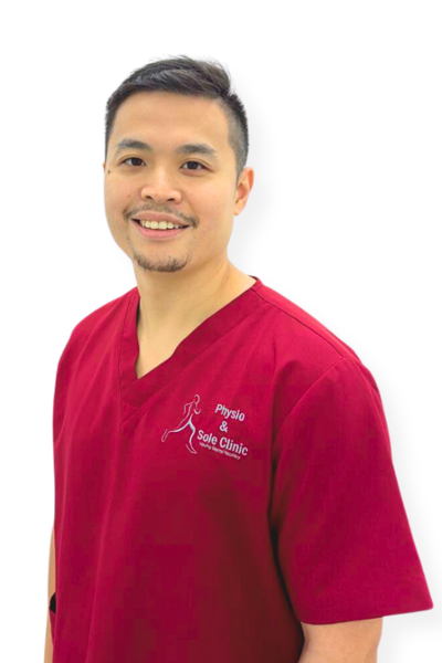 Physio and Sole Clinic senior Musculoskeletal Physiotherapist martin in red scrubs