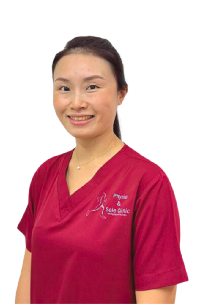 Physio and Sole Clinic Principal Musculoskeletal Physiotherapist Su Mei in red scrubs
