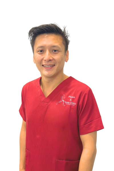Physio and Sole Clinic Director & Chief Sports Physiotherapist Wesley in red scrubs