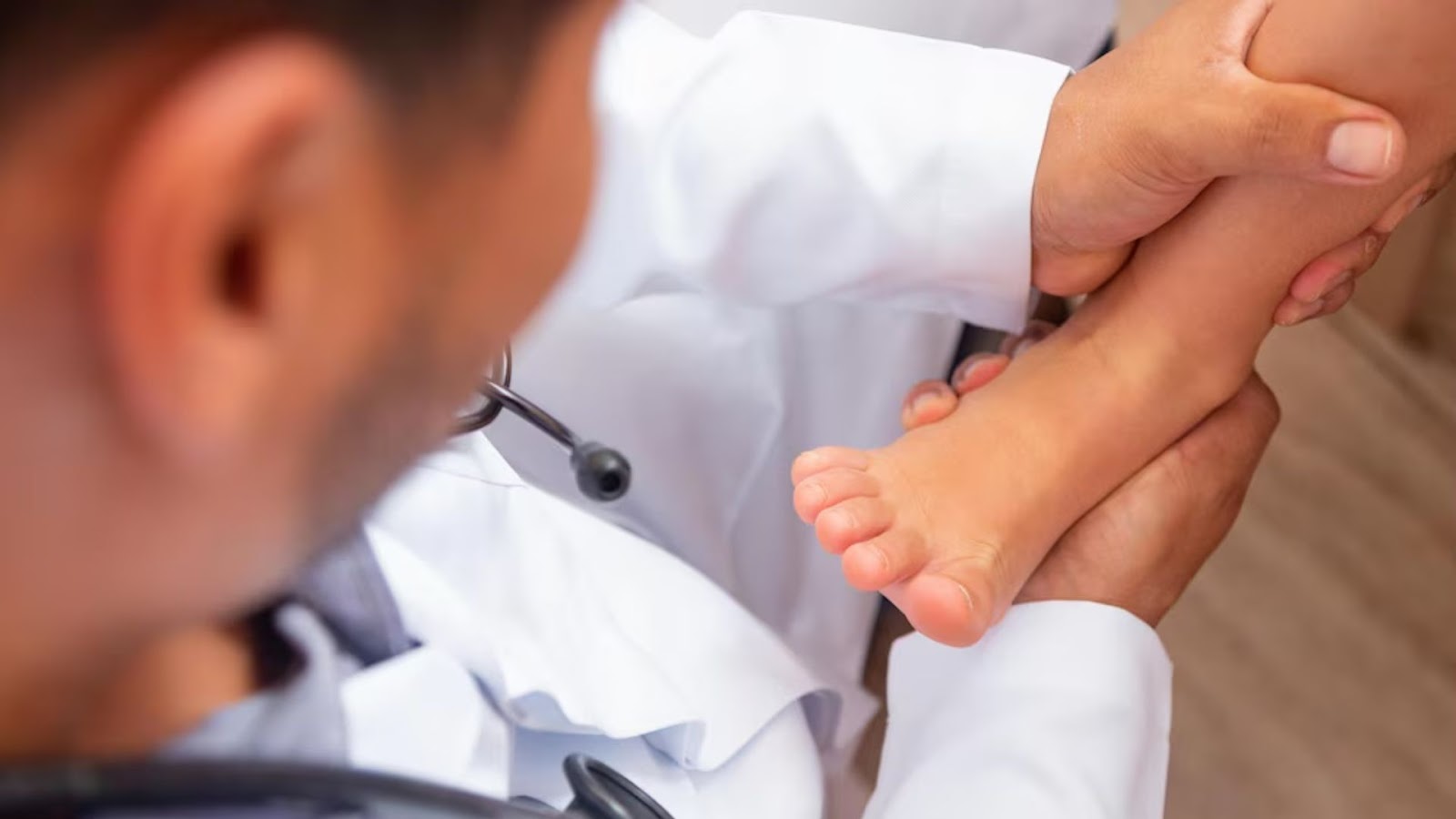 Healthcare professional examining a child’s foot – early podiatry intervention helps active kids prevent long-term issues.