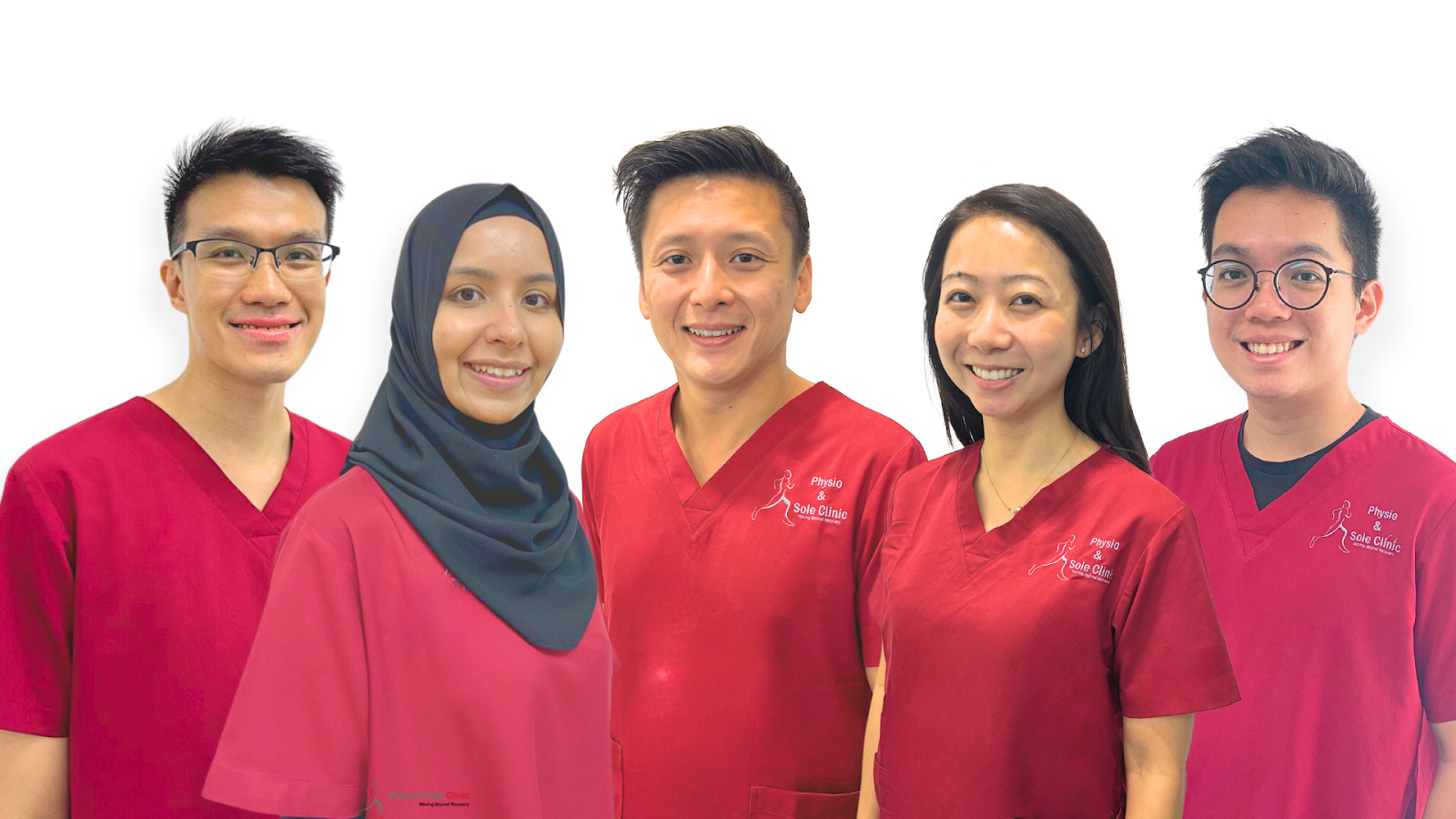 Team of physiotherapists at Physio & Sole Clinic in Singapore, wearing red uniforms