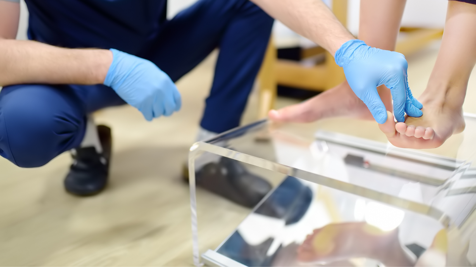Professional assessing foot position using a transparent orthotic measurement device.