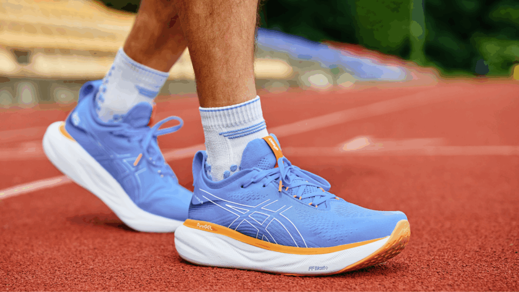 Close-up of cushioned running shoes on track, designed to reduce heel stress and support Achilles recovery.