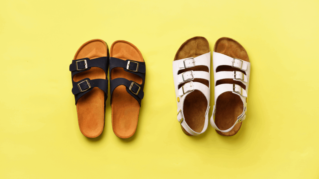 Two pairs of supportive cork sandals on yellow background