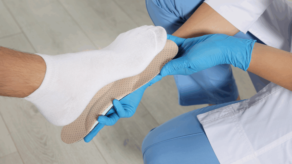 Professional podiatrist fitting custom orthotic insole for pigeon toe support