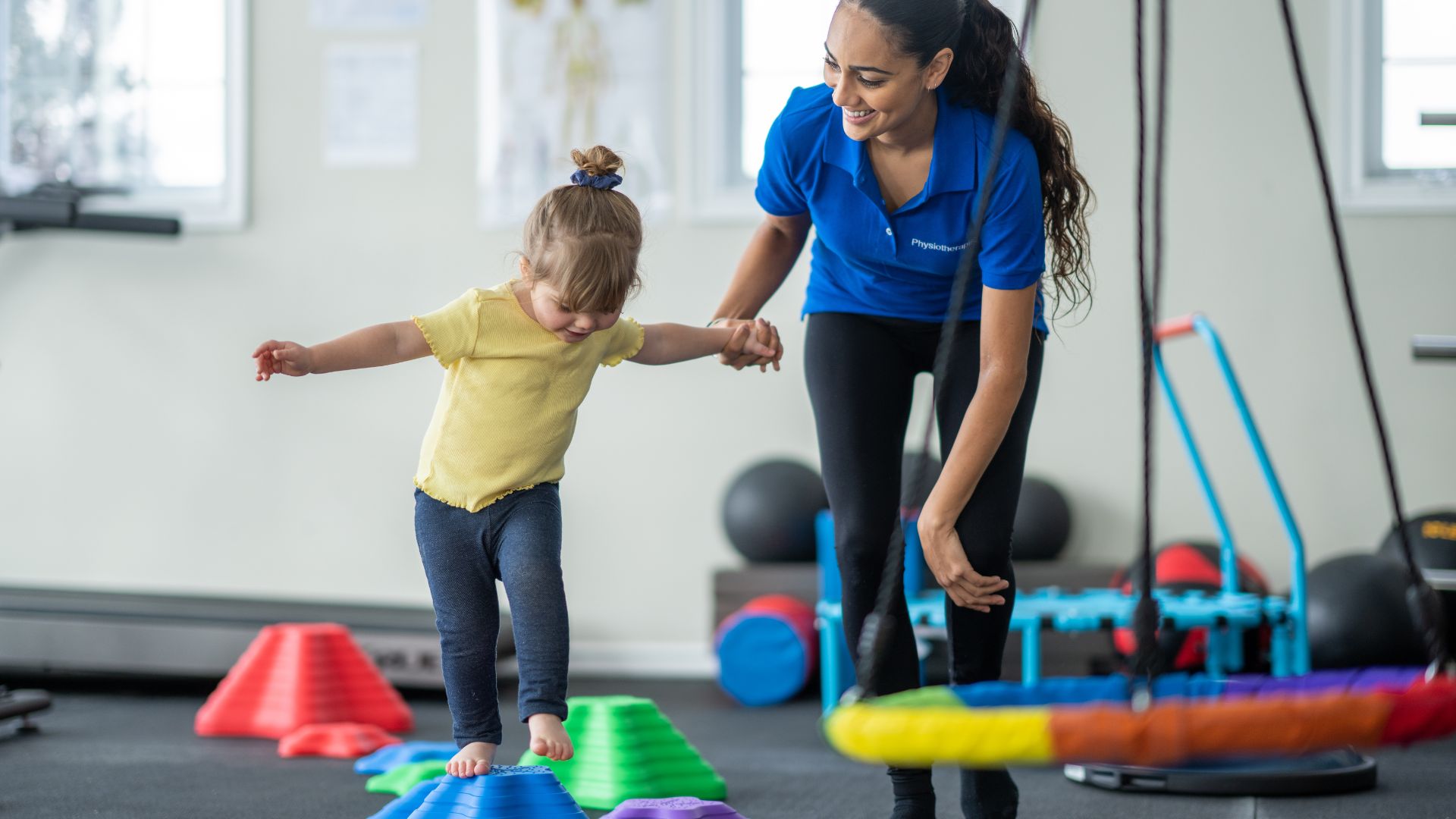Paediatric physiotherapist in Singapore helping a toddler improve balance and coordination through play-based physiotherapy.