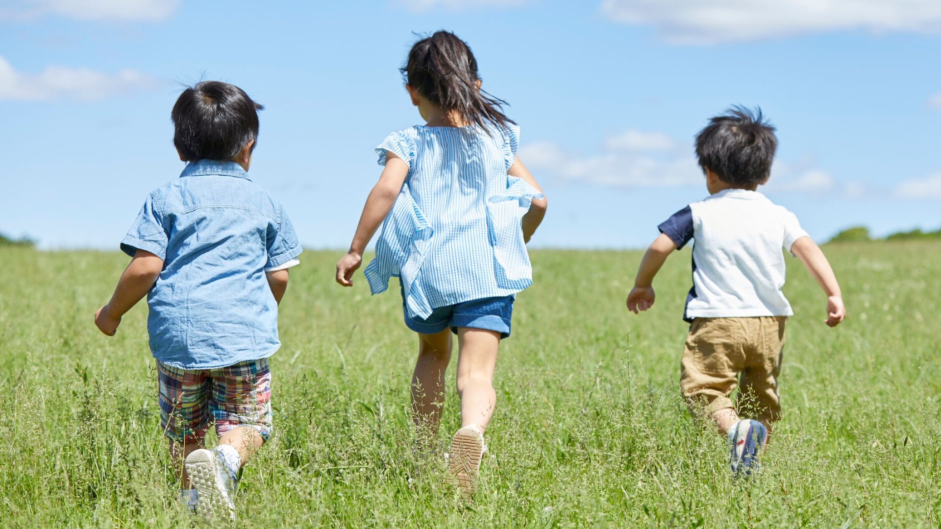 Children running outdoors showing natural movement and healthy foot development during play