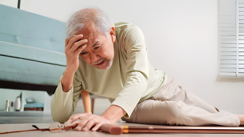 Elderly man on the floor after a fall at home, highlighting fall risk and mobility challenges in seniors.
