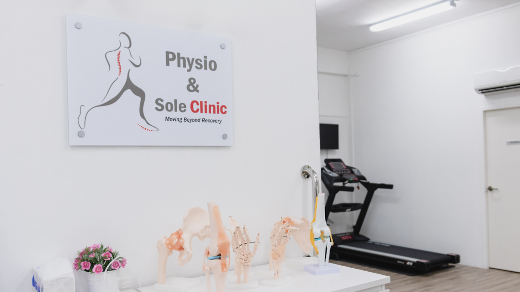 Physio & Sole Clinic interior with physiotherapy equipment and anatomical models in Singapore.