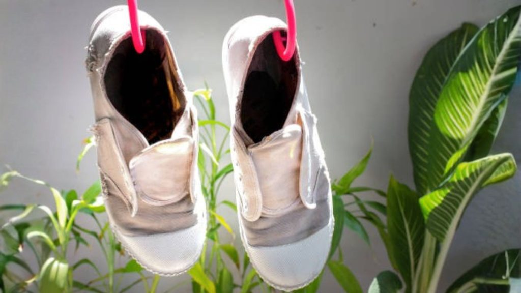 Children’s shoes drying in sunlight to prevent nail fungus in Singapore humid homes