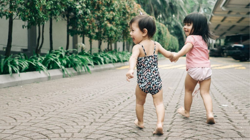 children walking outdoors illustrating unusual gait patterns that may require podiatry evaluation