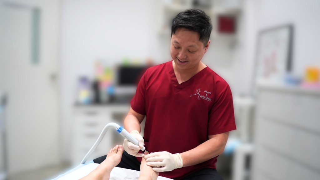 Podiatrist consultation for fungal nail treatment at a clinic in Singapore