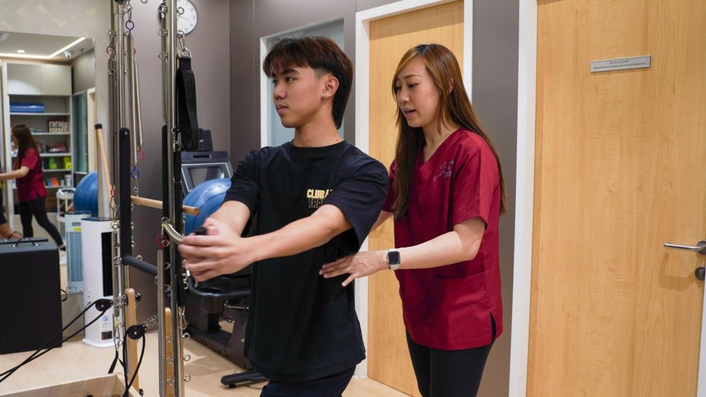 Sports injury physiotherapy in Singapore using resistance band exercises for recovery and strength training
