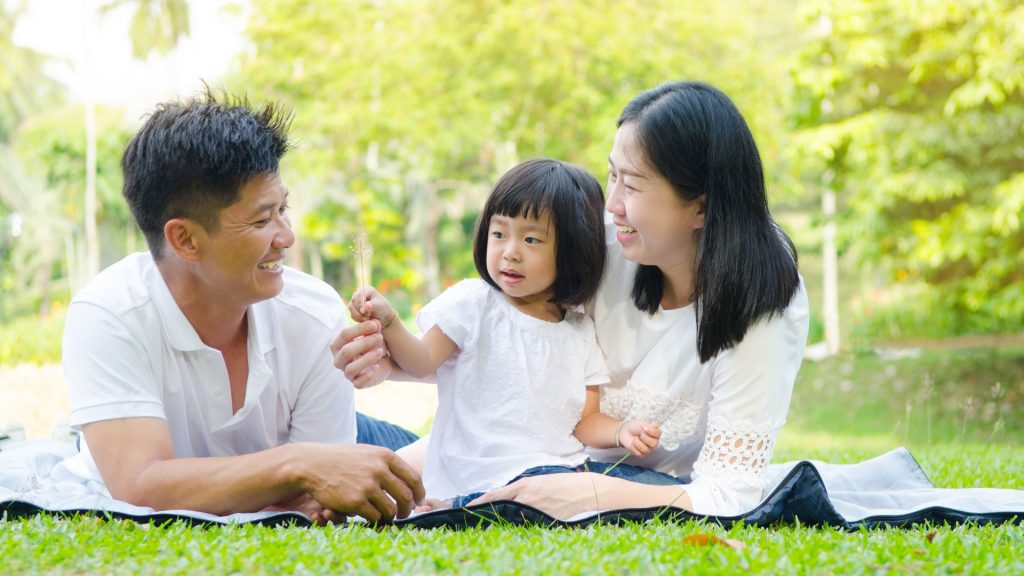 family spending time outdoors emphasising importance of healthy foot development for children