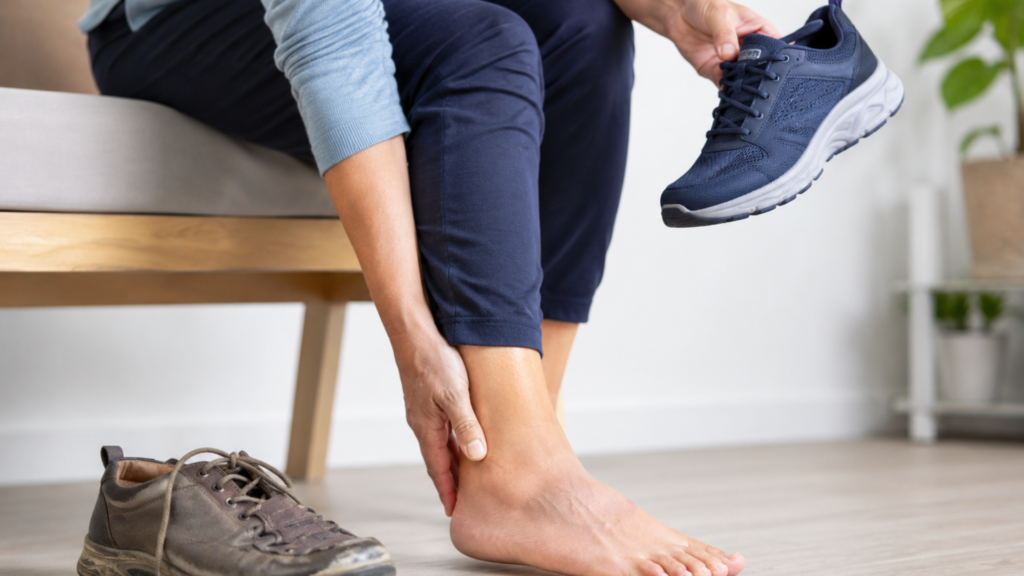 Person with heel pain comparing worn-out shoes with supportive footwear as a sign they may need orthopaedic shoes. 